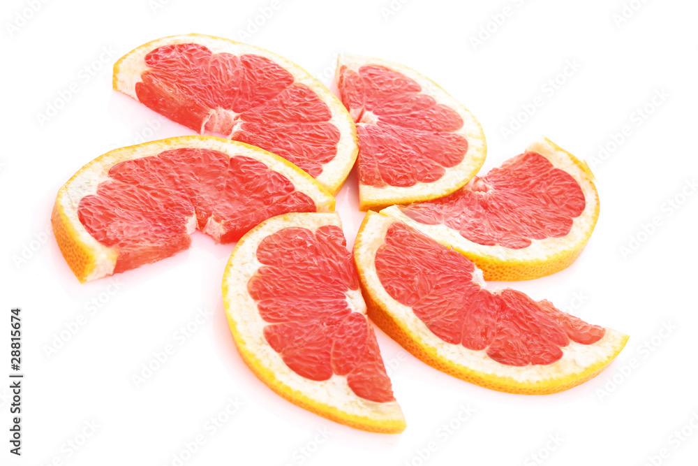Slices of grapefruit in the form of circle isolated on white Slices of grapefruit in the form of circle isolated on white