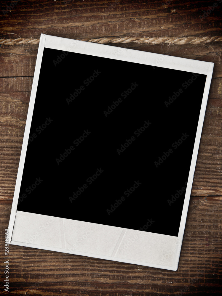 Old empty photo on wood background Old empty photo on wood background