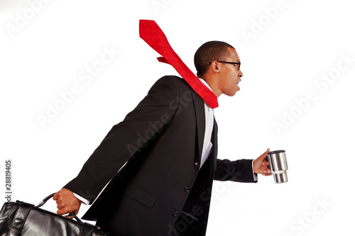 Isolated shot of a young businessman running.