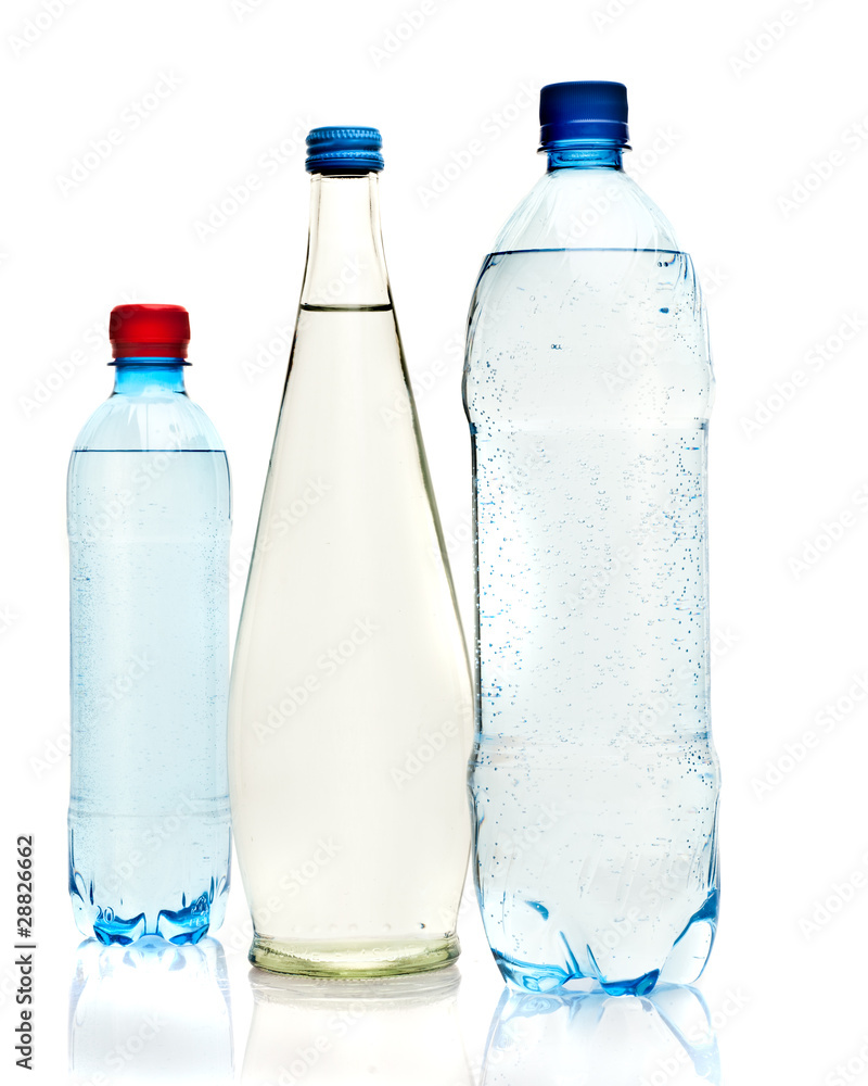 Bottles of water isolated on the white Bottles of water isolated on the white