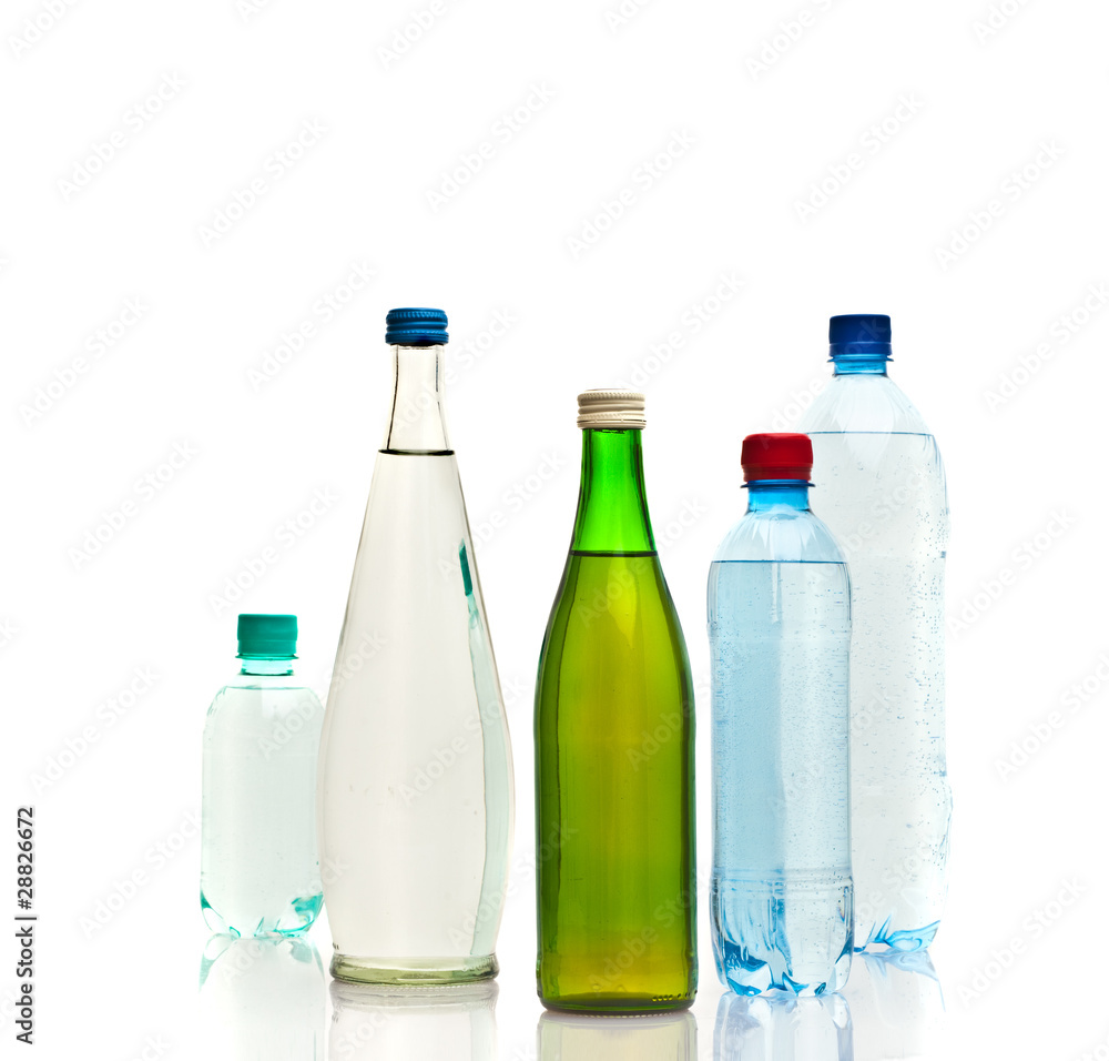 Bottles of water isolated on the white Bottles of water isolated on the white