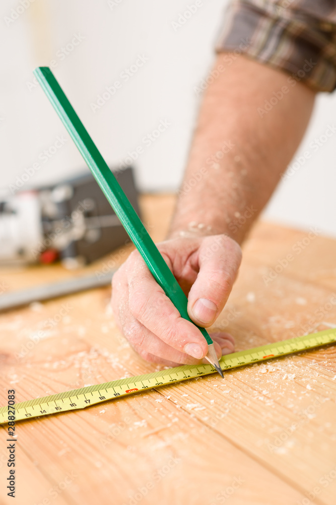 Home improvement - close-up of measuring wood Home improvement - close-up of measuring wood