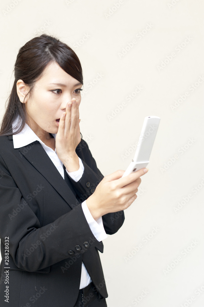 a portrait of young business woman using cellphone a portrait of young business woman using cellphone