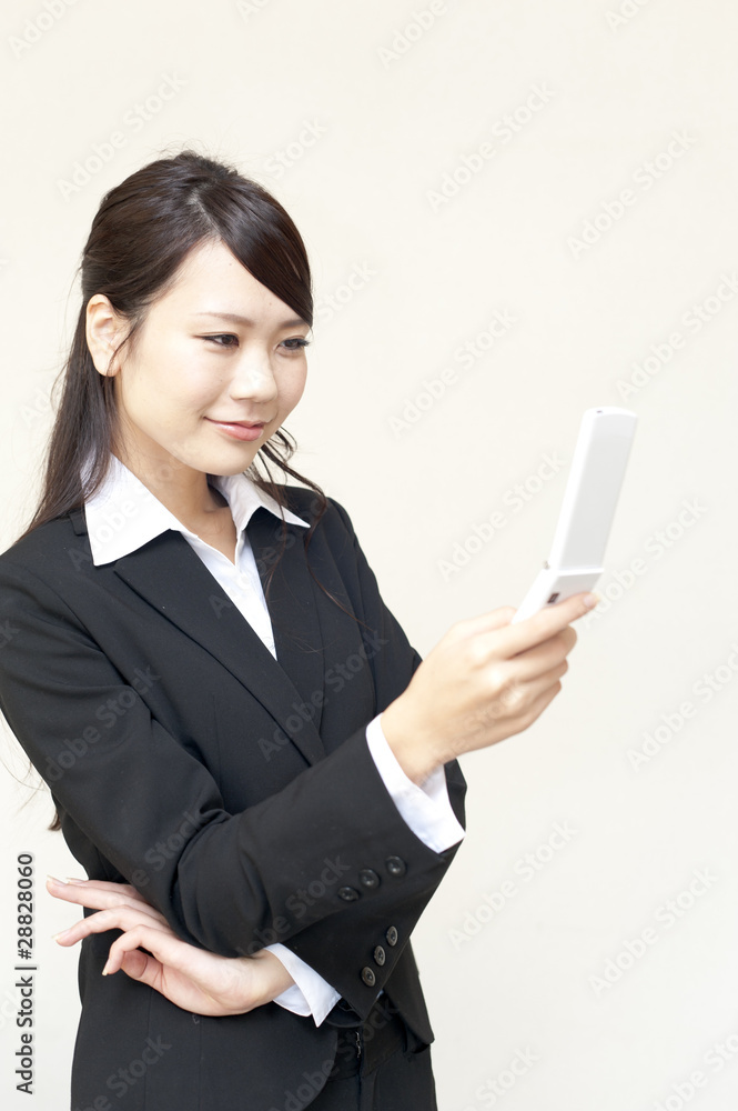 a portrait of young business woman using cellphone a portrait of young business woman using cellphone