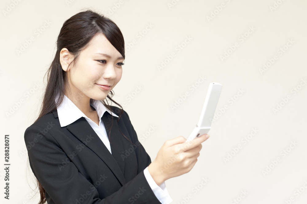 a portrait of young business woman using cellphone a portrait of young business woman using cellphone