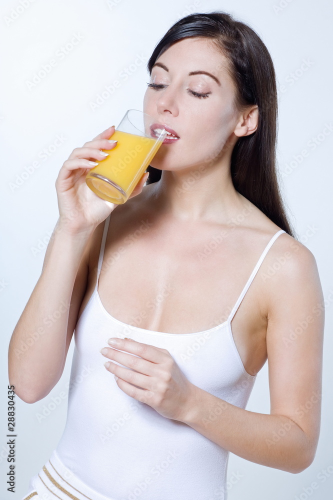beautiful young woman drinking orange juice beautiful young woman drinking orange juice