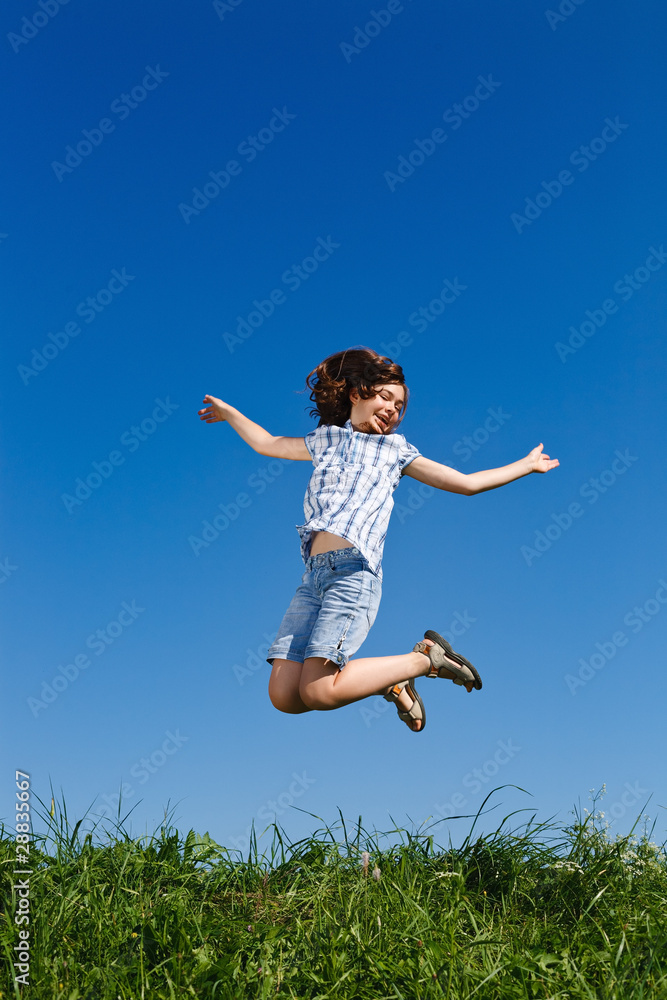 Girl jumping, running against blue sky Girl jumping, running against blue sky