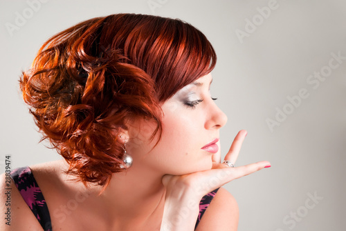 portrait of attractive red haired young woman