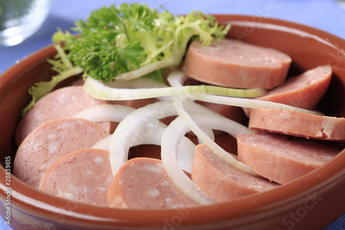 Sliced sausages and onion
