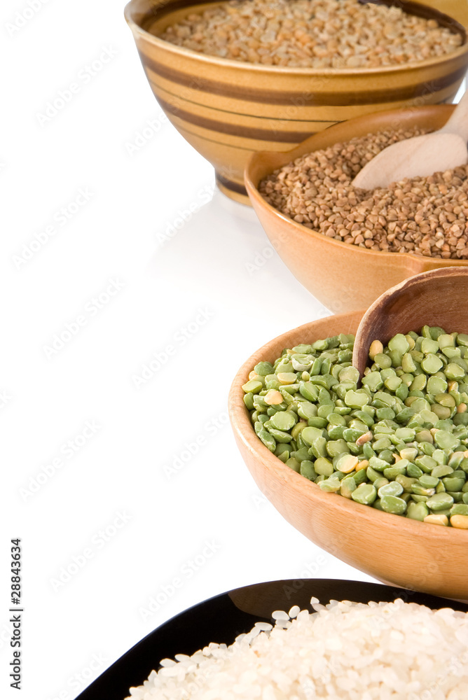 rice, pea and buckwheat in plate isolated on white rice, pea and buckwheat in plate isolated on white