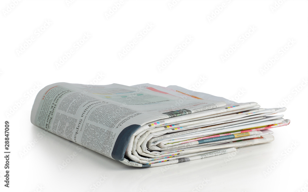 stack of news paper over white background stack of news paper over white background
