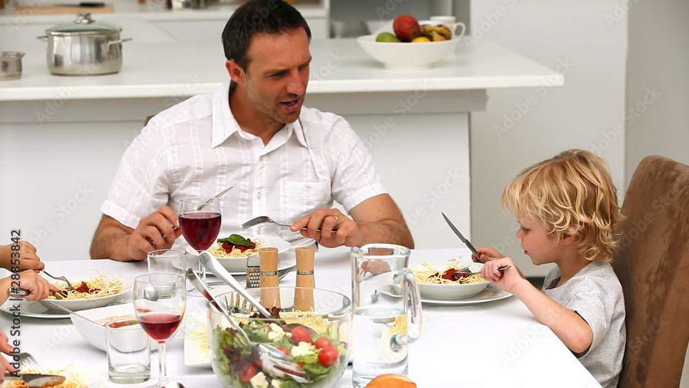 Family dinning together at the table Family dinning together at the table