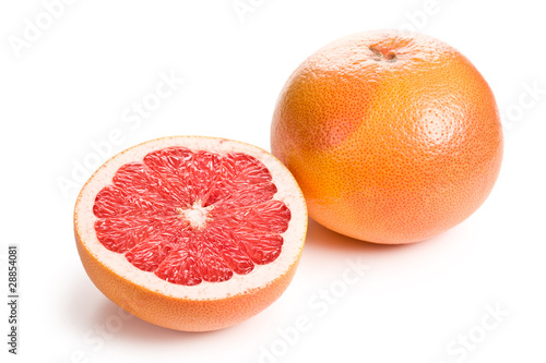 sliced red grapefruit on white