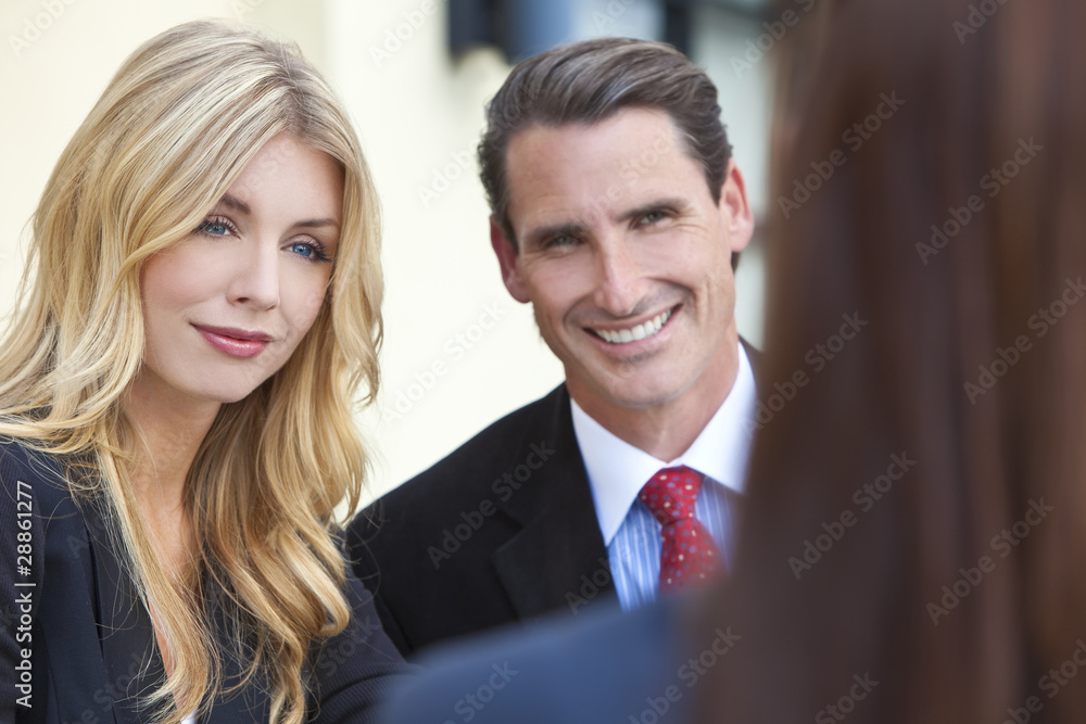 Attractive Businesswoman in Meeting with Colleagues Attractive Businesswoman in Meeting with Colleagues