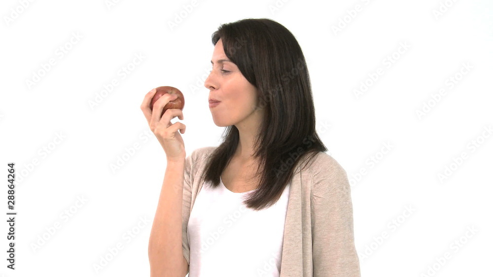 Pretty woman eating an apple