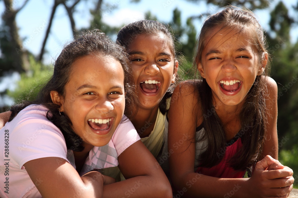 Three school girls enjoying happy moment in the sunshine Three school girls enjoying happy moment in the sunshine
