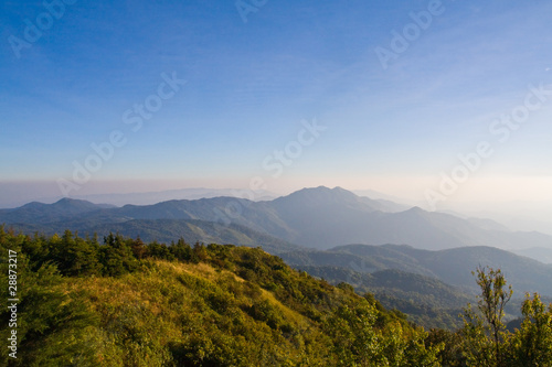 Fog on the mountain with green hill © criminalatt