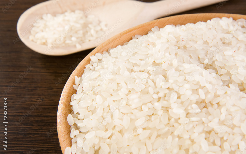 rice and plate with wooden spoon rice and plate with wooden spoon