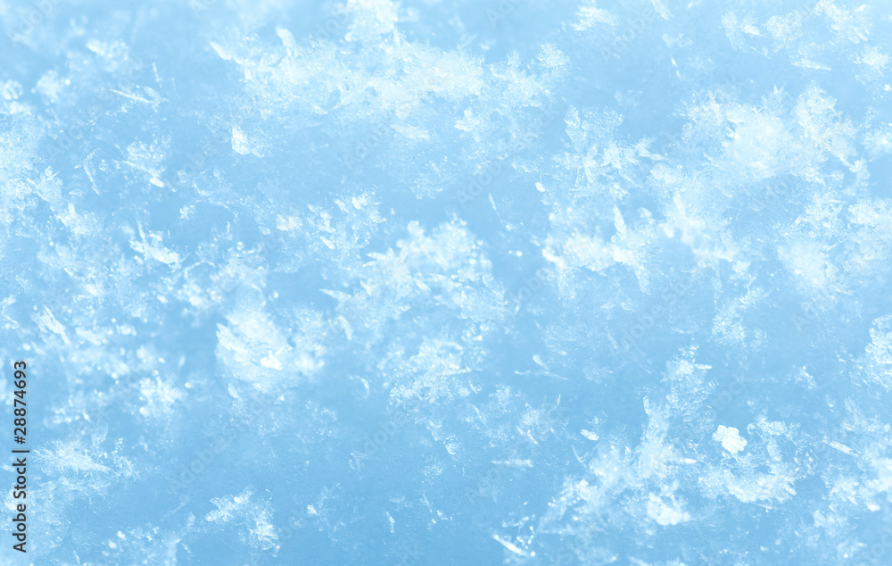 Obraz premium Winter snowflakes on snow surface (macro)