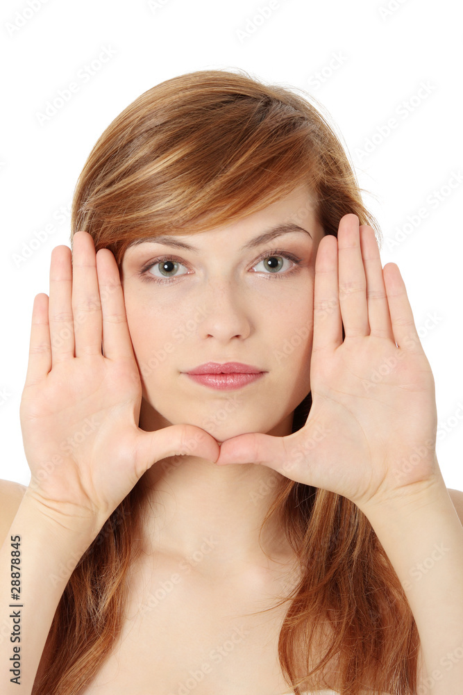 Beautiful teen woman making frame on her face Beautiful teen woman making frame on her face