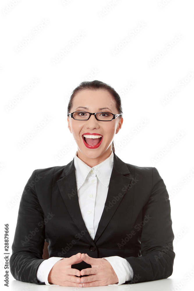 Young happy businesswoman behind the desk Young happy businesswoman behind the desk