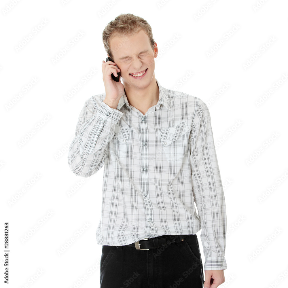 A handsome happy man using mobile phone A handsome happy man using mobile phone