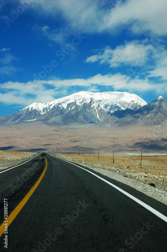 Highway towards snow mountains © bbbar