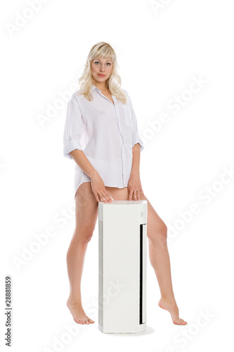 Photography Beautiful girl with a new model for the air conditioner.