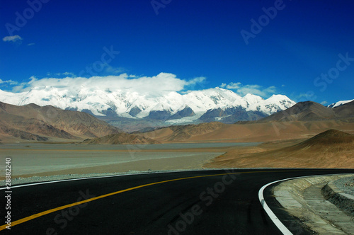 Highway towards snow mountains © bbbar