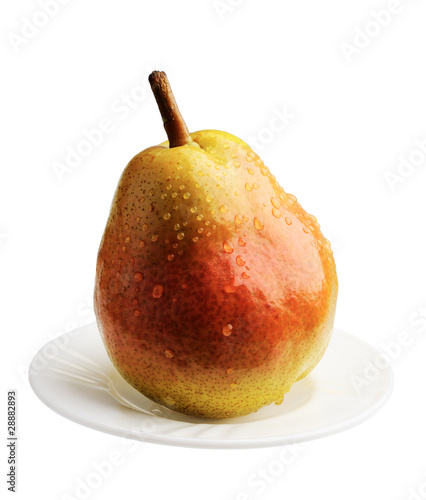 Pear on a white plate, isolated