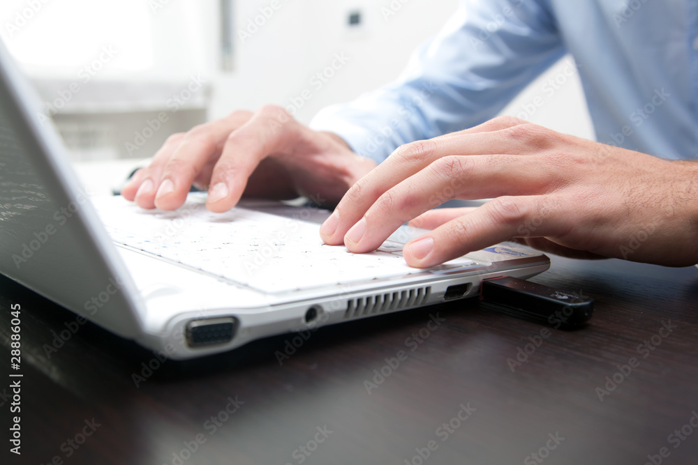 Businessman typing on the laptop Businessman typing on the laptop