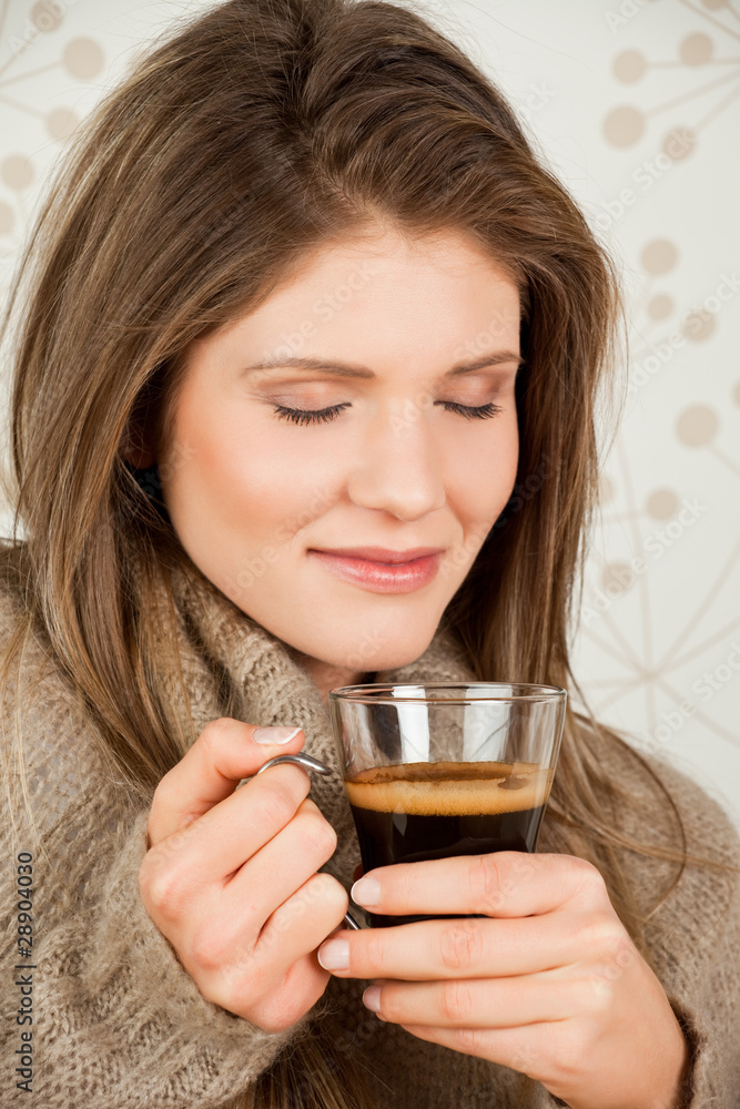 Beauty, young girl holding a cup of coffee Beauty, young girl holding a cup of coffee