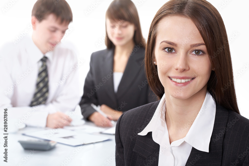 Beautiful woman on the background of business people Beautiful woman on the background of business people