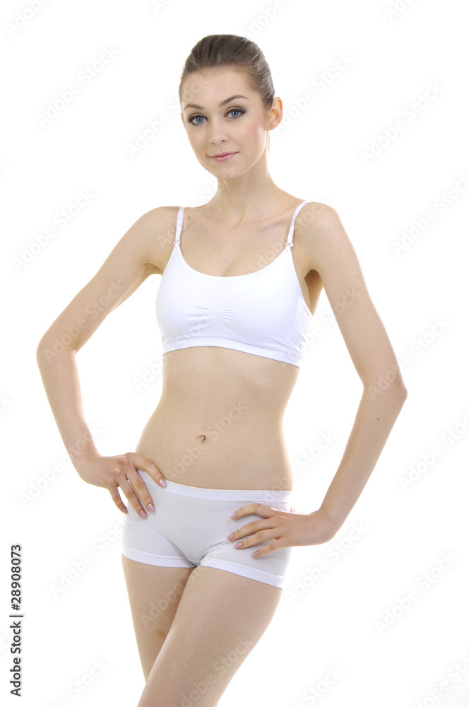 Smiling busty brunette in white lingerie isolated on white Smiling busty brunette in white lingerie isolated on white