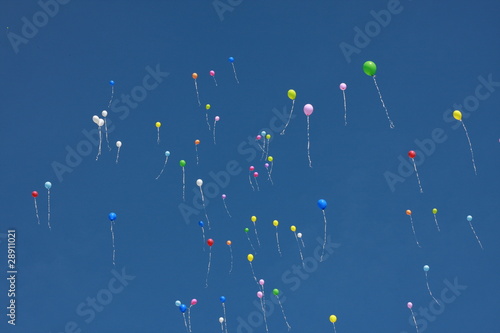 Balloons fly in the sky