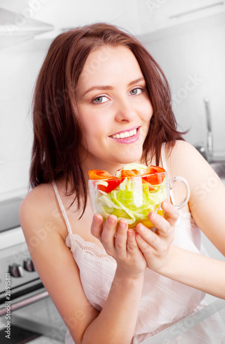 woman eating salad