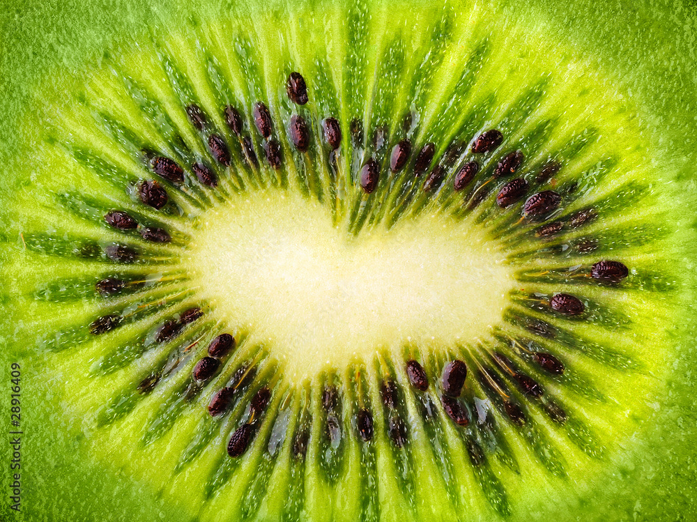 Macro shot of sliced kiwi with heart-shaped core Macro shot of sliced kiwi with heart-shaped core