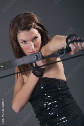 woman with bow aiming