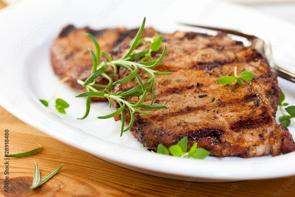 Grilled pork with fresh rosemary and thyme