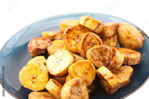 bananas in caramel lying on a plate