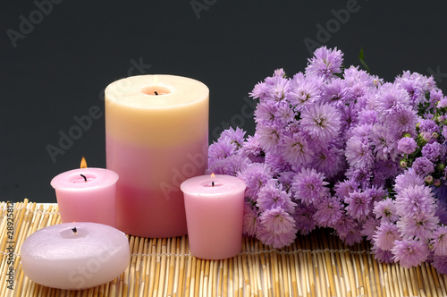 beauty treatment- candles and daisy flowers on black