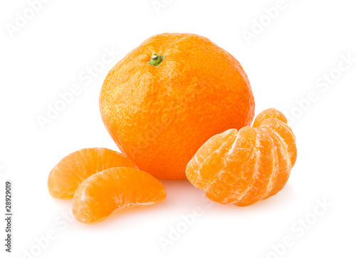 Ripe tangerine with slices isolated on white background