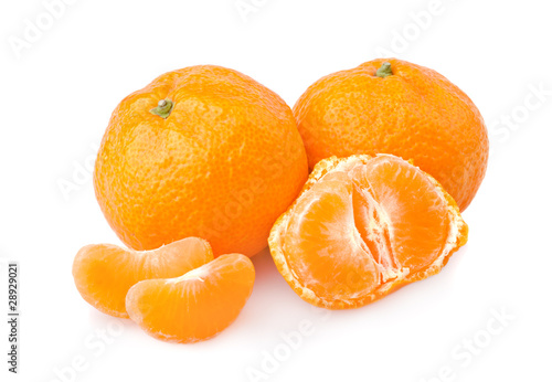 Ripe tangerines with slices isolated on white background