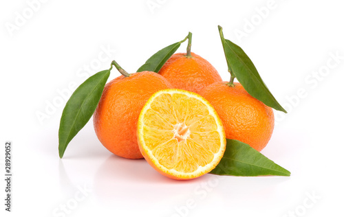 Ripe tangerines with leaves and slice