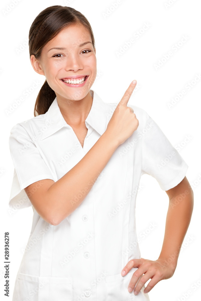 Spa woman employee pointing at white backgroud Spa woman employee pointing at white backgroud