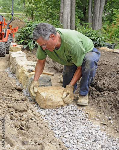 Man building stone wall