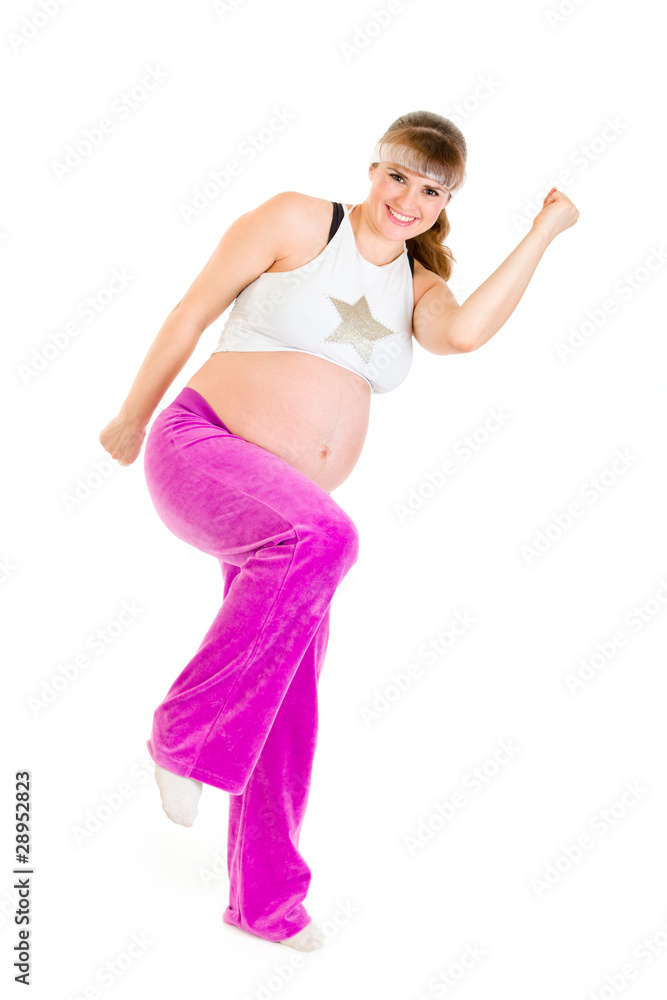 Smiling beautiful pregnant woman doing fitness exercises Smiling beautiful pregnant woman doing fitness exercises