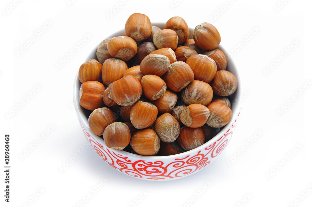 a bowl full of hazelnuts a bowl full of hazelnuts