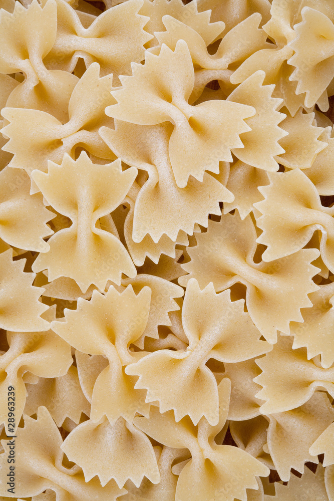 Close-up of raw farfalle pasta Close-up of raw farfalle pasta