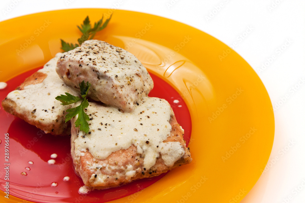 Grilled salmon with cream sauce and parsley Grilled salmon with cream sauce and parsley